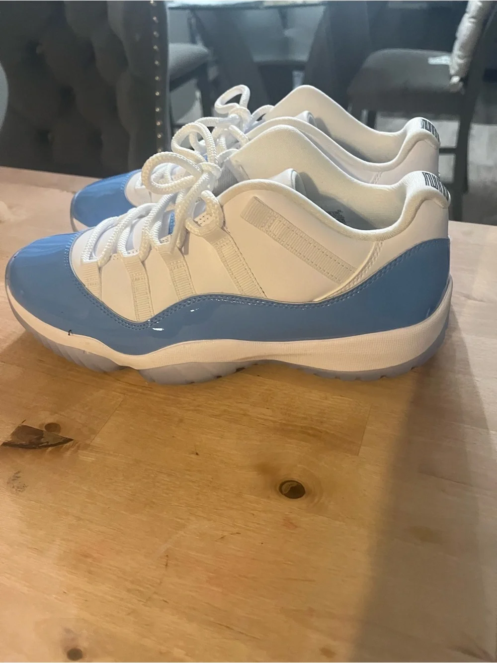 UNC Jordan 11 Low-Top Sneakers in White and Light Blue Patent